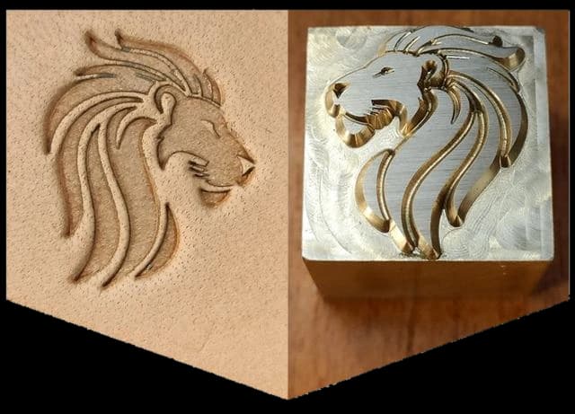 A brass lion stamp beside its embossed mark in vegetable-tanned leather